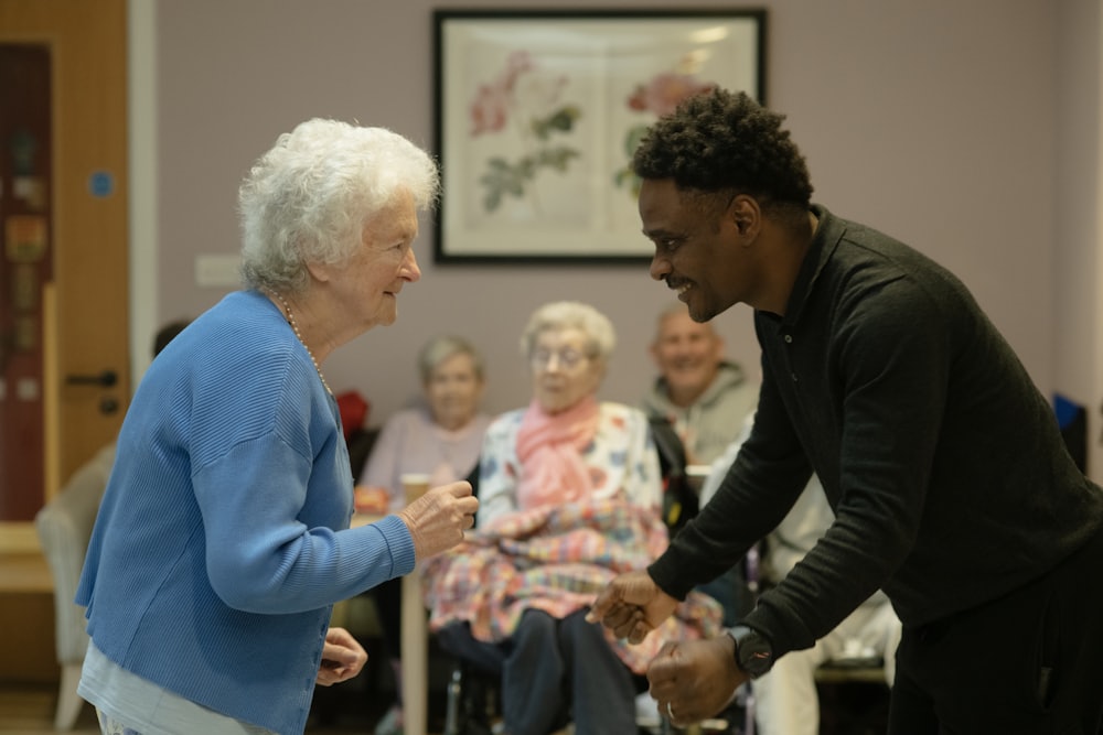 A caregiver sharing a joyful moment with a senior at home